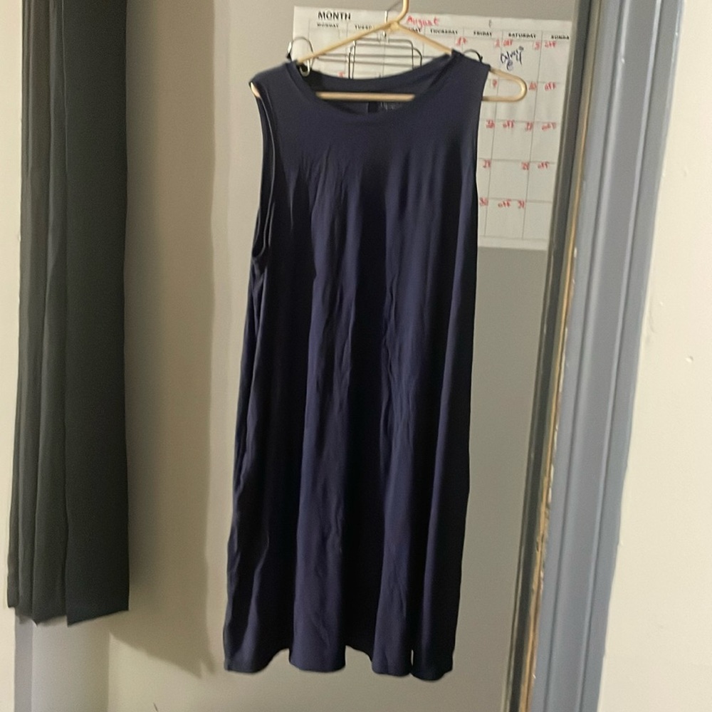 Cute comfy sleeveless dress with pockets.